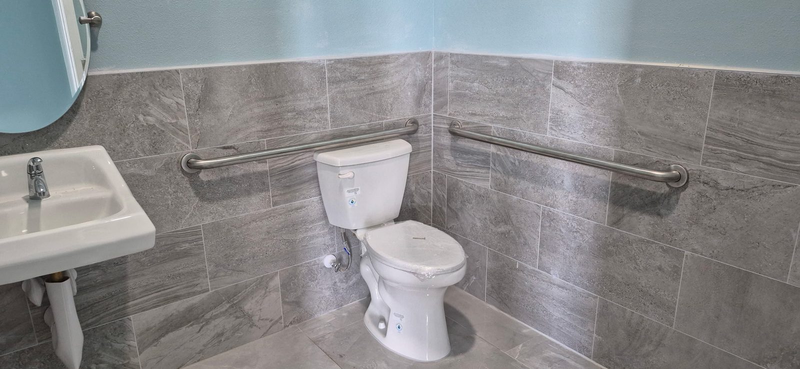 Remodeled bathroom with tile walls